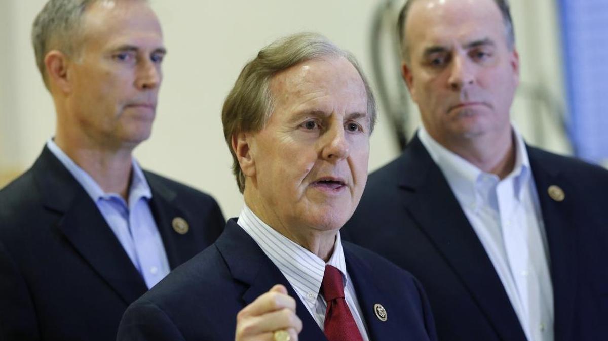 U.S. Representatives Robert Pittenger, center.