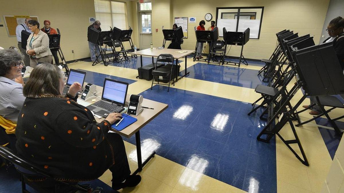 People take advantage of the first day of early voting in Charlotte at the Central Piedmont Community College Facilities Services building at 1325 East 7th Street, Thursday morning, Oct. 23, 2014.