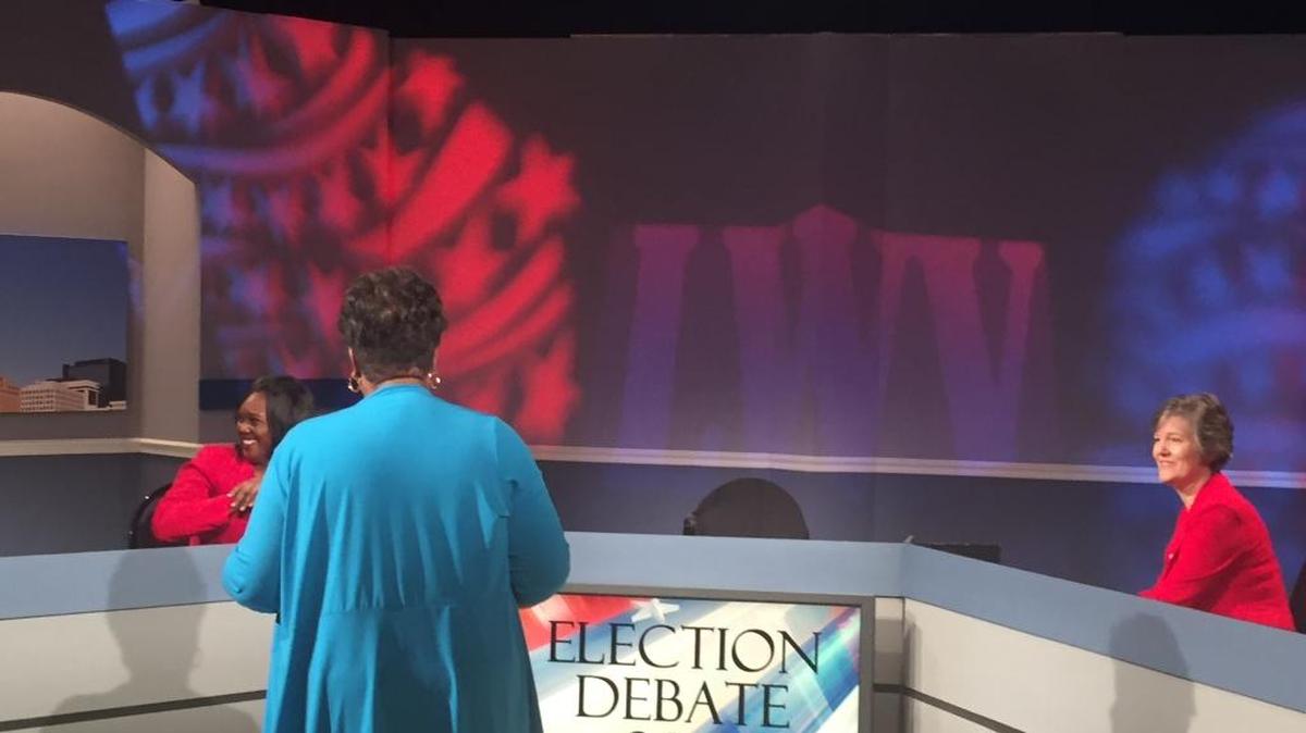 Mecklenburg District Court candidates Aretha Blake, left, and Tracy Hewett share a light moment off camera before their debate Wednesday at WTVI.