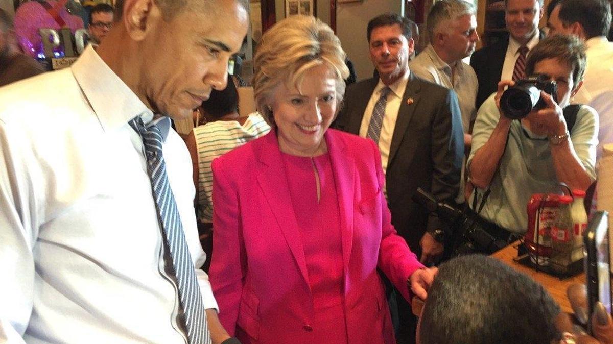 President Barack Obama and Hillary Clinton talk to patrons at Midwood Smokehouse during an unannounced visit following their joint appearance.