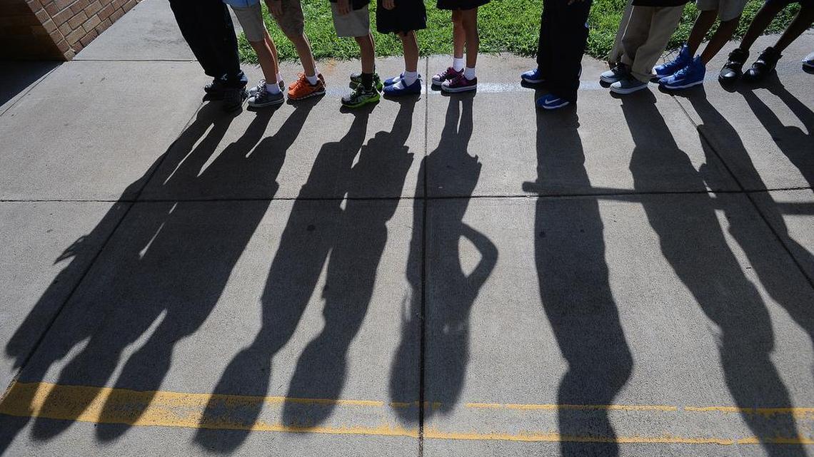 
On the first day of school at Shamrock Elementary, students line up before heading into class.
