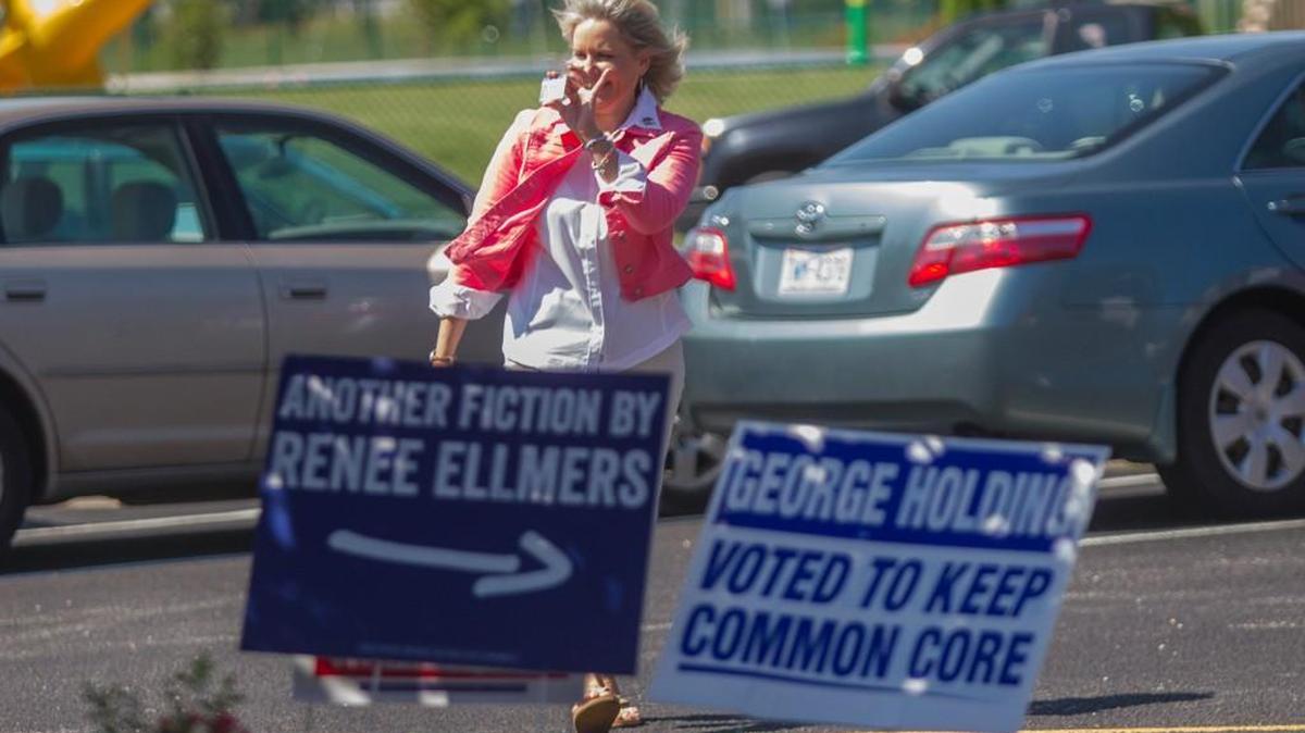 U.S. Rep. Renee Ellmers returns from her car with her identification card after forgetting to bring it inside her polling place before casting her District 2 primary ballot Tuesday, June 7, 2016 at Wayne Avenue Elementary in Dunn.