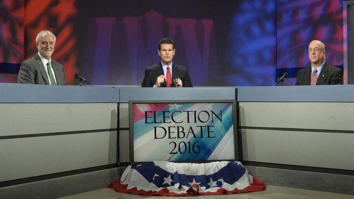Moderator, Jeff Rivenbark, center, poses questions to Democratic candidates, Billy Maddalon, right, and John Autry during a 20 minute debate segment at WTVI Tuesday, February 16, 2016. WTVI and the League of Woman Voters of Charlotte Mecklenburg partnered for the Election Debate 2016.