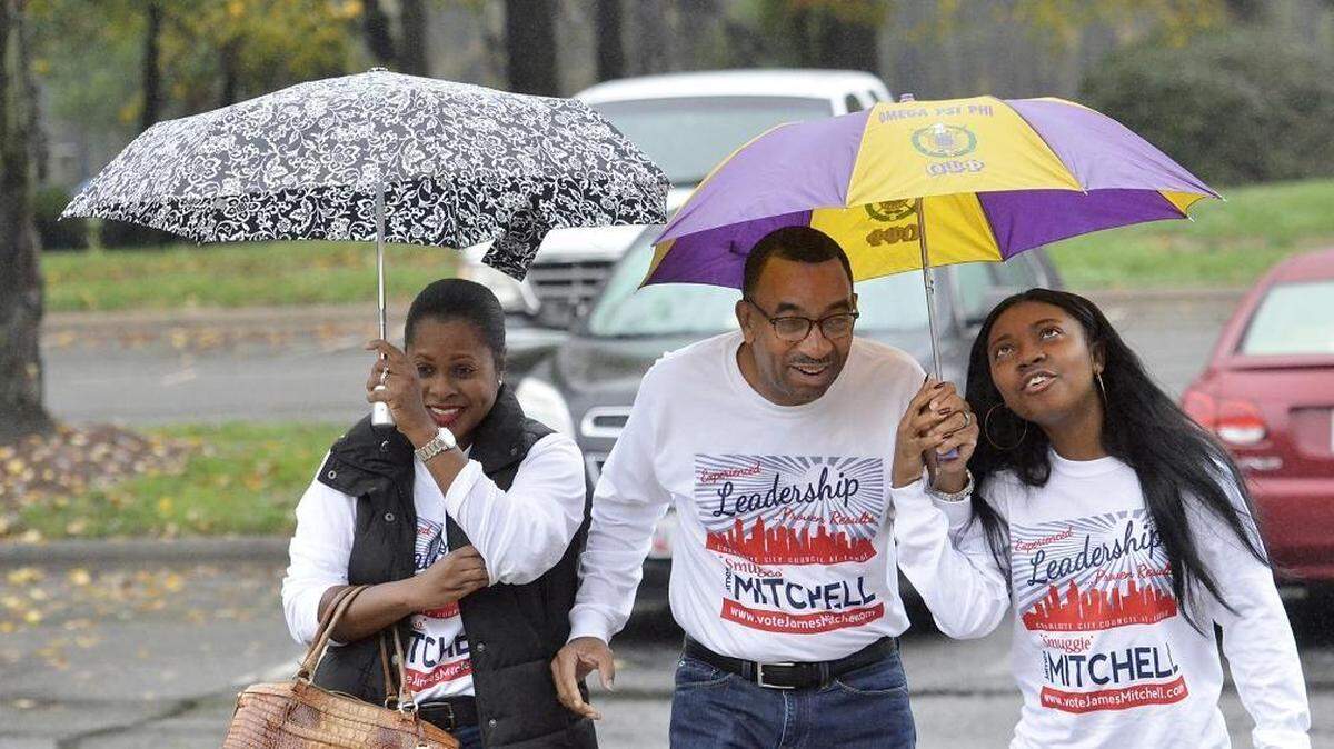 James Mitchell, a candidate for Charlotte city council at-large voted with his wife Joan Higginbotham Mitchell (left) and daughter, Kayla Mitchell (right), 18 at precinct 214, University City United Methodist Church on Tuesday November 3, 2015. It was his daughter's first vote in a general election. She also voted in the primary.