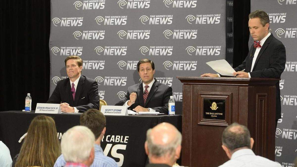 
Republican Mayoral candidates from left,Edwin Peacock III, Scott Stone, TWC News Charlotte political anchor Tim Boyum,the moderator, during the Mayoral debate held Tuesday at Ballantyne Hotel.
