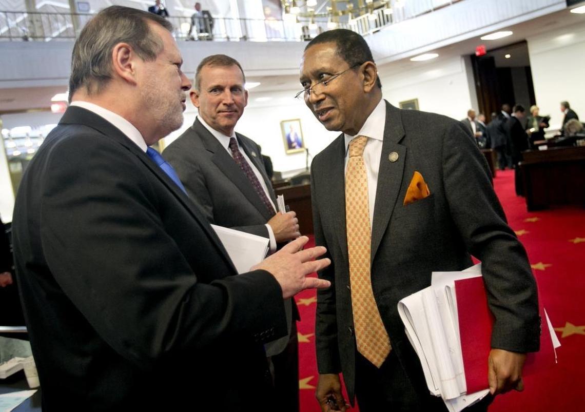 Republican Senate leader Phil Berger, left, and Senate Majority Leader Harry Brown, center, talk with Sen. Floyd McKissick Jr., a Democrat, right, in this 2016 file photo. McKissick resigned Jan. 7, 2020 to take an appointment to the N.C. Utilities Commission.
