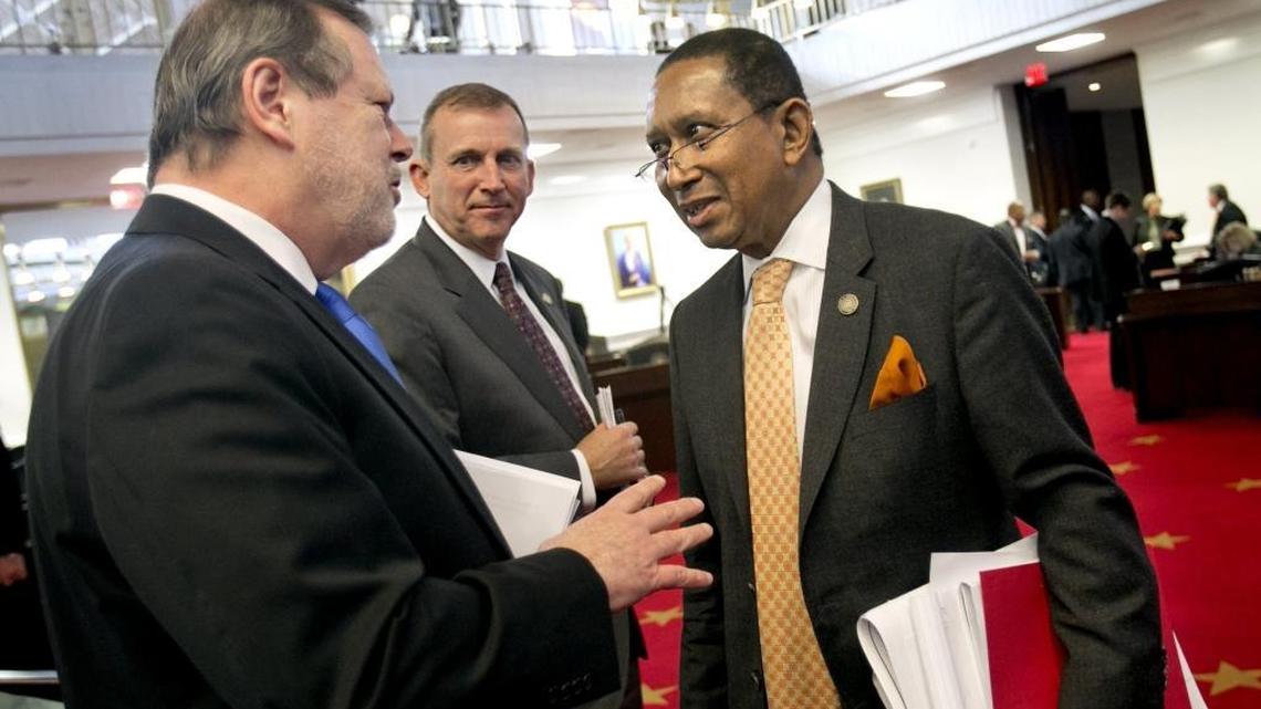 Republican Senate leader Phil Berger, left, and Senate Majority Leader Harry Brown, center, talk with Sen. Floyd McKissick Jr., a Democrat, right, in this 2016 file photo. McKissick resigned Jan. 7, 2020 to take an appointment to the N.C. Utilities Commission.