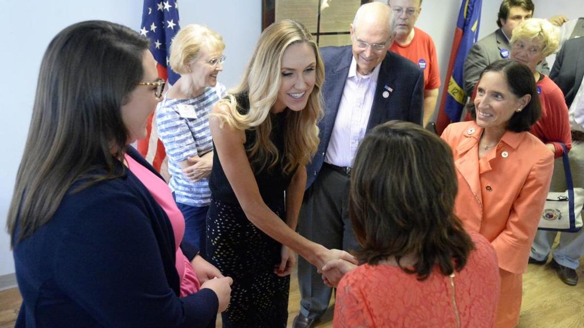 Lara Trump, left, greets campaign workers while helping to open a RNC Victory Office in Charlotte on Wednesday, September 14, 2016.