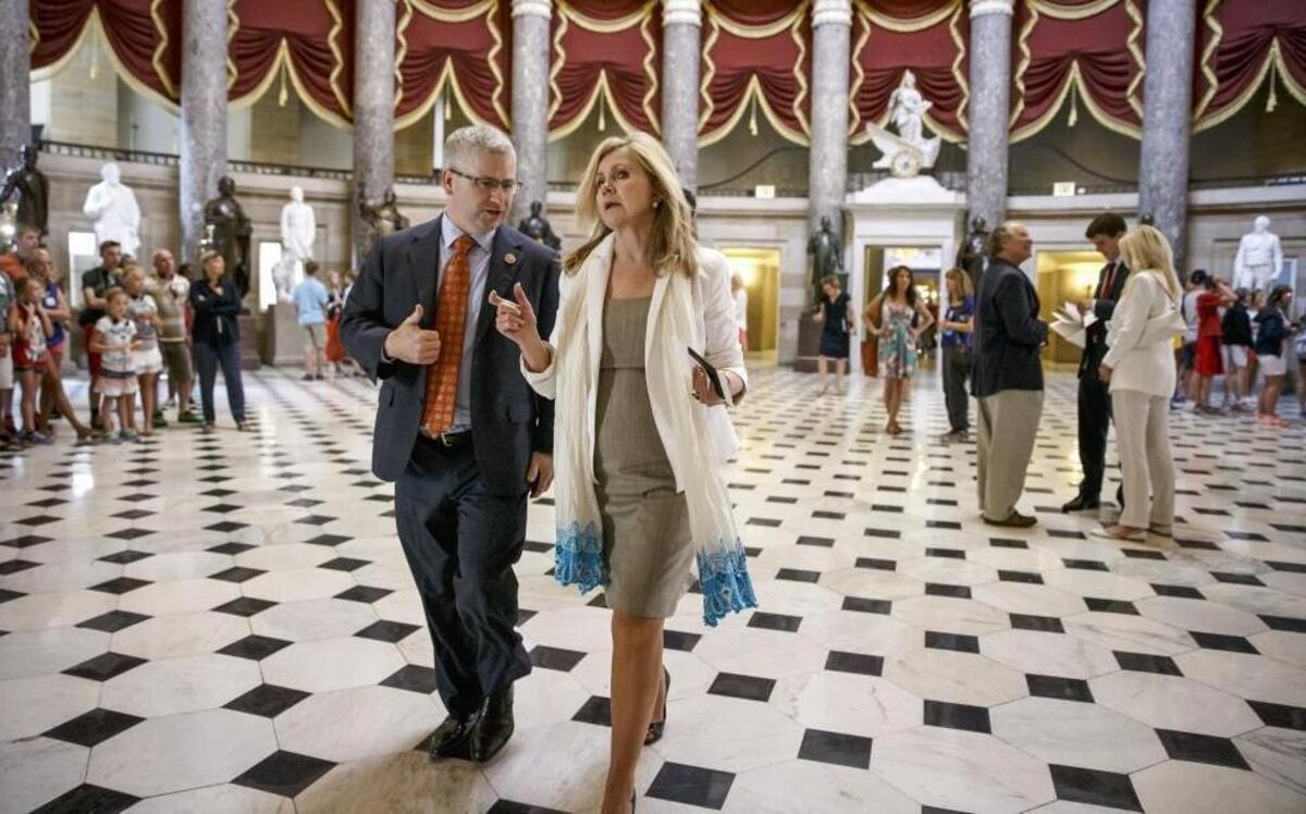 FILE – North Carolina’s Rep. Patrick McHenry is the No. 4-ranking Republican in the U.S. House. He’s the highest-ranking member of party leadership from North Carolina. Here, McHenry walks and talks with Rep. Marsha Blackburn, R-Tenn.