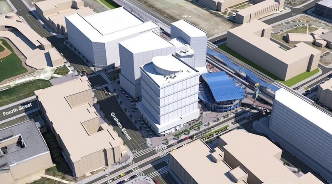 This is an overhead view of how Gateway Station might be developed. The train station has a blue roof. The buildings in white would be offices, retail and residential.