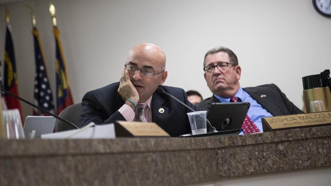 State Board of Elections members Joshua Malcolm, left, and A. Grant Whitney Jr. discuss early voting during a meeting Sept. 8, 2016, in Raleigh.
