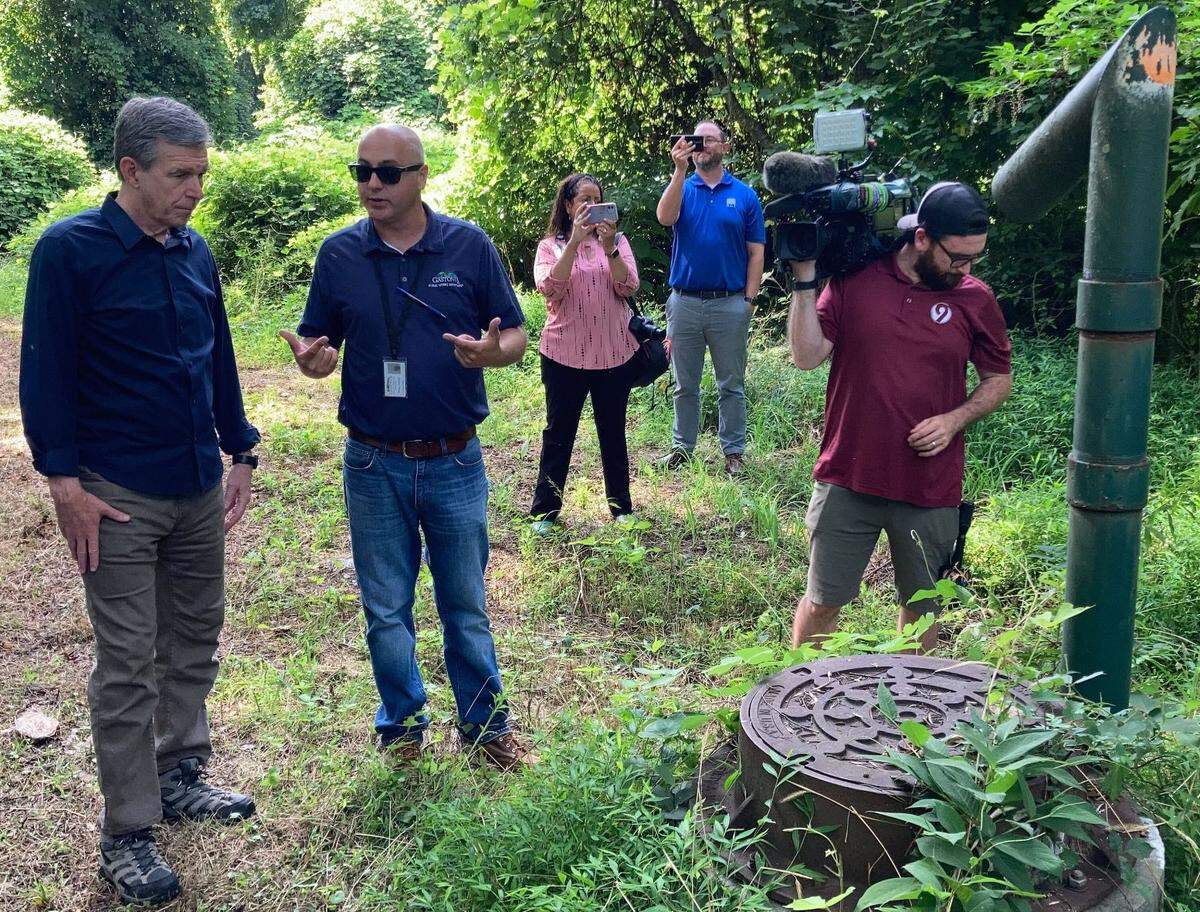 Gov. Roy Cooper joined federal officials from FEMA and the White House Friday, Aug, 12, 2022, for a tour of a project paid for with climate resiliency funds in Gastonia. To Cooper’s right is Robert Cloninger, assistant director of public works for the city of Gastonia.