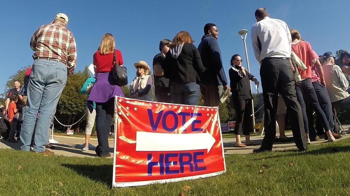 Voters wait in line for early voting at the Lake Lynn Community Center in Raleigh, N.C. Wednesday, October 26, 2016.