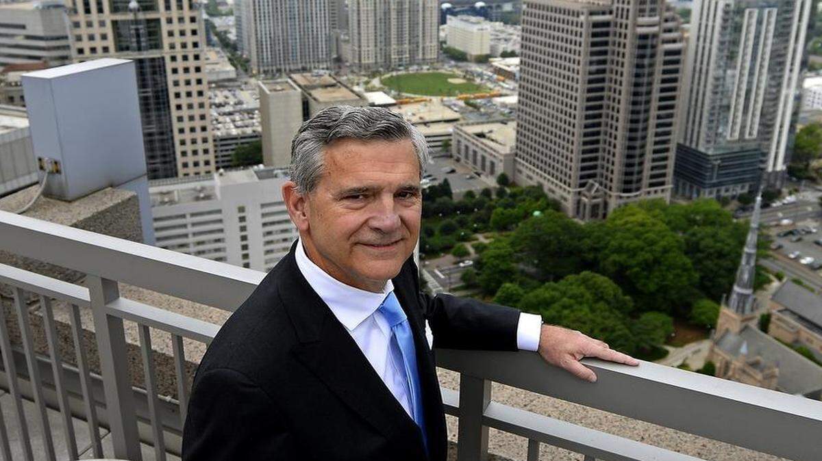 
John Fennebresque, on a balcony at his McGuireWoods office on Tryon Street, has been a powerful player in civic life since he arrived in Charlotte in 1973. 

