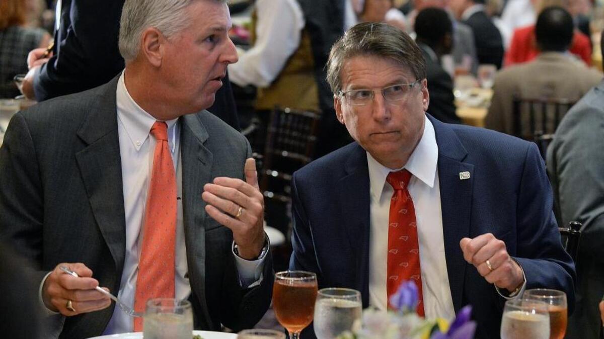 Democratic Gov. Roy Cooper asked Charlottean John Lassiter, left, to step down as chairman of North Carolina’s Economic Development Partnership board after he helped dilute the governor’s influence on the board. Former Gov. Pat McCrory, right, appointed him to the job.