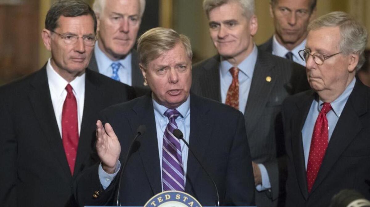 Sen. Lindsey Graham, R-S.C., joined by, from left, Sen. John Barrasso, R-Wyo., Majority Whip John Cornyn, R-Texas, Sen. Bill Cassidy, R-La., Sen. John Thune, R-S.D., and Senate Majority Leader Mitch McConnell, R-Ky., speaks to reporters as he pushes a last-ditch effort to uproot former President Barack Obama's health care law, at the Capitol in Washington on Tuesday.