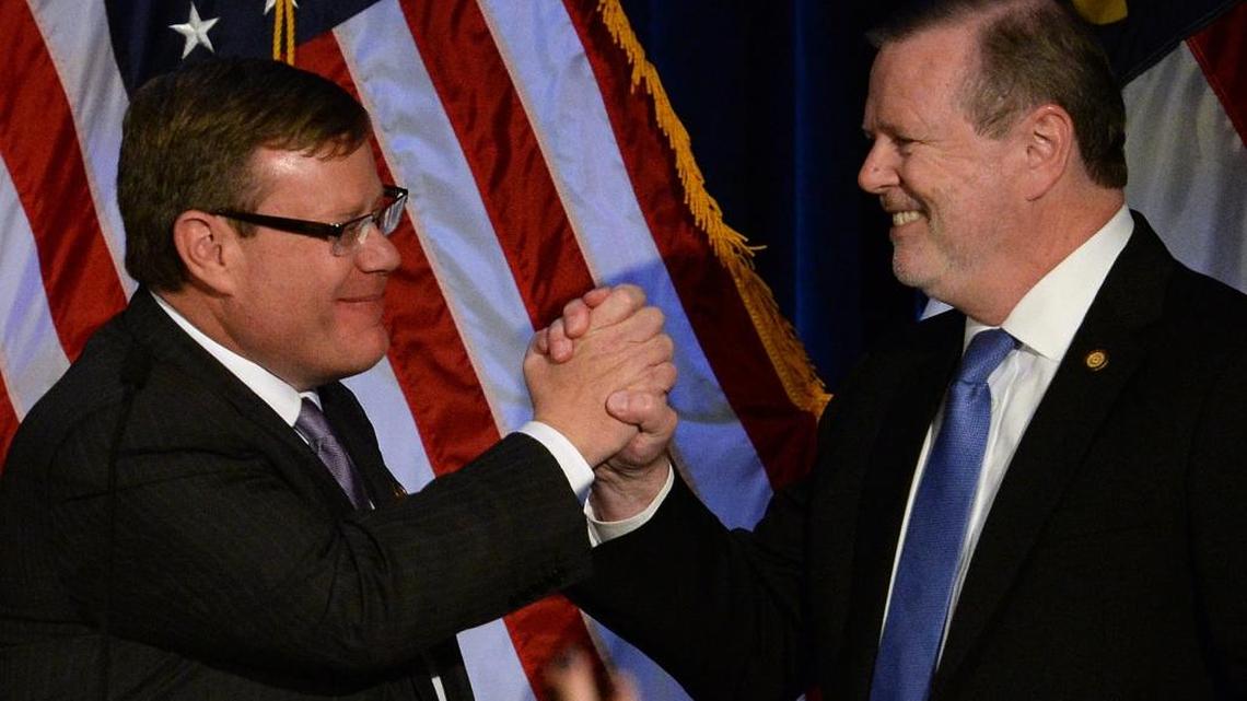 Senate leader Phil Berger (right) and House Speaker Tim Moore congratulate each other after seeing election returns at the Crabtree Marriott in Raleigh, N.C., on Tuesday, Nov. 8, 2016.