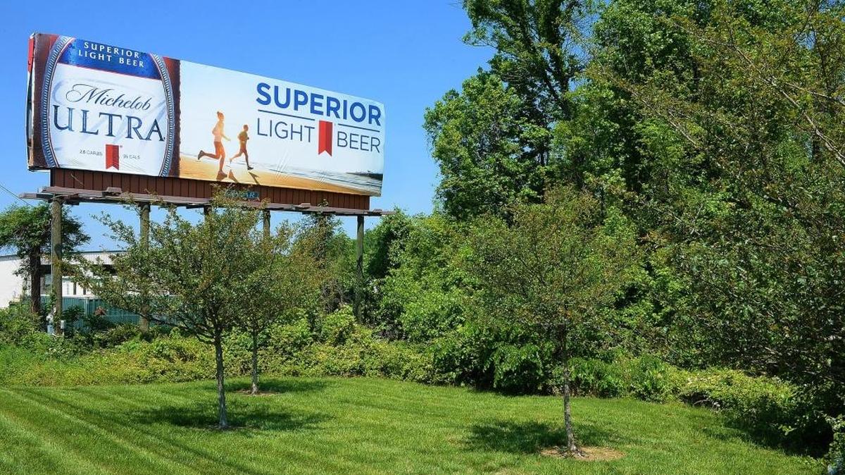 Billboards on Trailer drive can be seen along I-85. Environmentalists say North Carolina new legislation would destroy trees for better views of billboards.