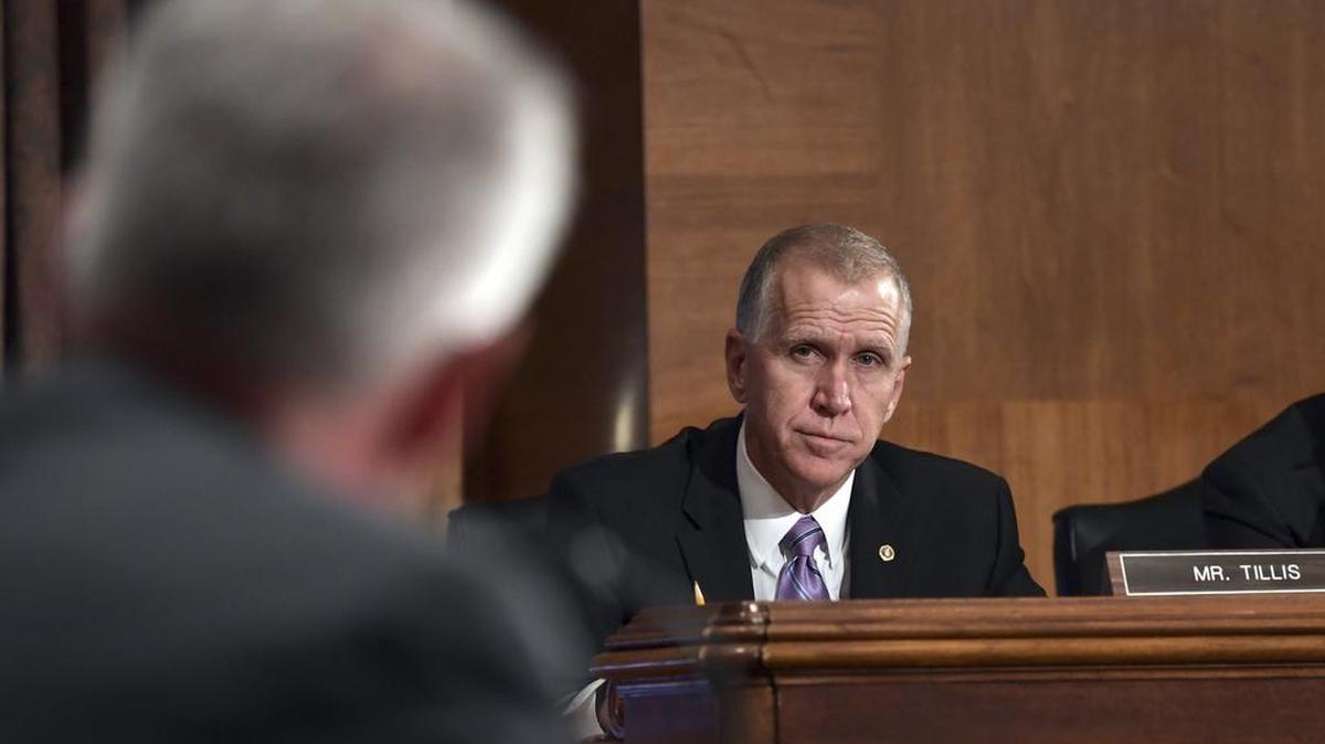 Sen. Thom Tillis listens as Wells Fargo Chief Executive Officer and President Timothy Sloan testifies before the Senate Committee on Banking, Housing and Urban Affairs on Capitol Hill in Washington, Tuesday, Oct. 3, 2017.