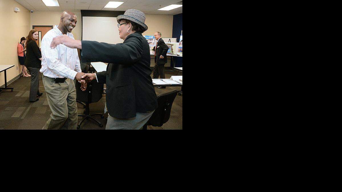 
Goodwill client Warren Melvin hugs Congresswoman Alma S. Adams (NC-12) after talking with her during her visit to Goodwill Industries of the Southern Piedmont at the Career Development Center on Freedom Drive in Charlotte on Wednesday, April 8, 2015, as part of her Undercover Congresswoman series. During her time at Goodwill, Congresswoman Adams spoke with several Goodwill clients to understand the struggles of many seeking employment in the region. Undercover Congresswoman is a series of monthly tours highlighting companies that provide career opportunities and employ constituents from the 12th District of North Carolina. The goal of this outreach is to learn more about the challenges facing employers, employees and the unemployed in the 12th Congressional District. Congresswoman Adams is a member of the Committee on Small Business, Education and the Workforce Committee and Joint Economic Committee. 
