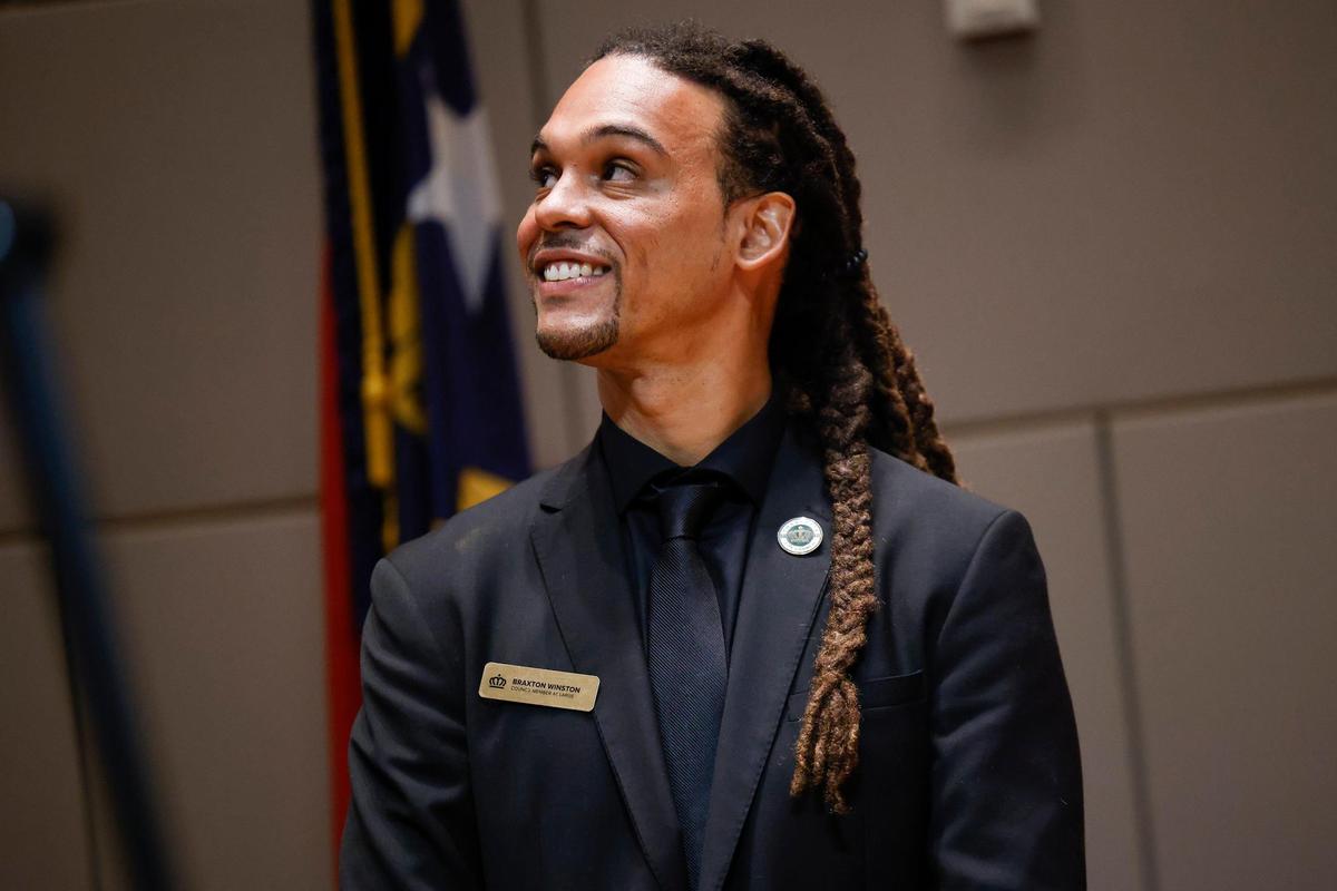 At-Large Charlotte City Council Member Braxton Winston glances to the crowd before taking his oath at the Charlotte-Mecklenburg Government Center in Charlotte, N.C., Tuesday, Sept. 6, 2022. Winston was selected as the new Charlotte mayor pro tem.