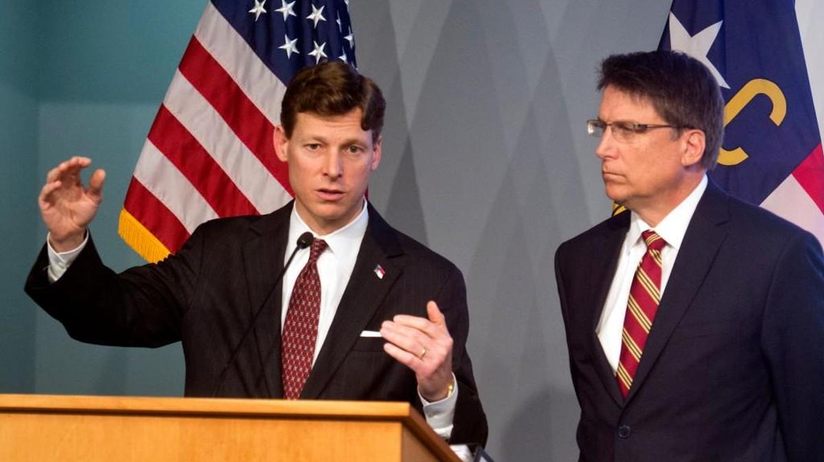 On March 5, 2015, newly appointed State Budget Director Lee Roberts, left, addresses members of the media, as N.C. Governor Pat McCrory listens They unveiled the governor's proposed 2015-2017 budget for the state.