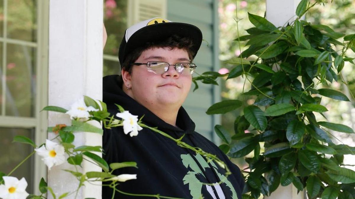 In this Aug. 25, 2015, file photo, Gavin Grimm poses on his front porch during an interview at his home in Gloucester, Va. The fate of North Carolina's new bathroom law could be determined by the 4th U.S. Circuit Court of Appeals in Richmond, which is expected to rule soon on Grimm's challenge. The high school student was born female but identifies as male, and says it's discriminatory to make him use the girls room or a single-stall unisex restroom.