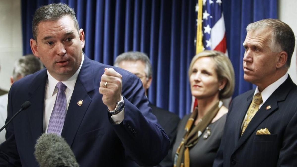 Rep. David Lewis, left, seen here at a 2013 news conference, took steps to help a friend and campaign donor keep his state contract by adding a provision to the final bill of this year’s legislative session.