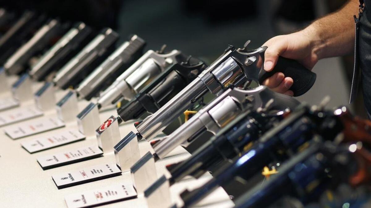 In this Jan. 19, 2016 file photo, handguns are displayed at the Smith & Wesson booth at the Shooting, Hunting and Outdoor Trade Show in Las Vegas.