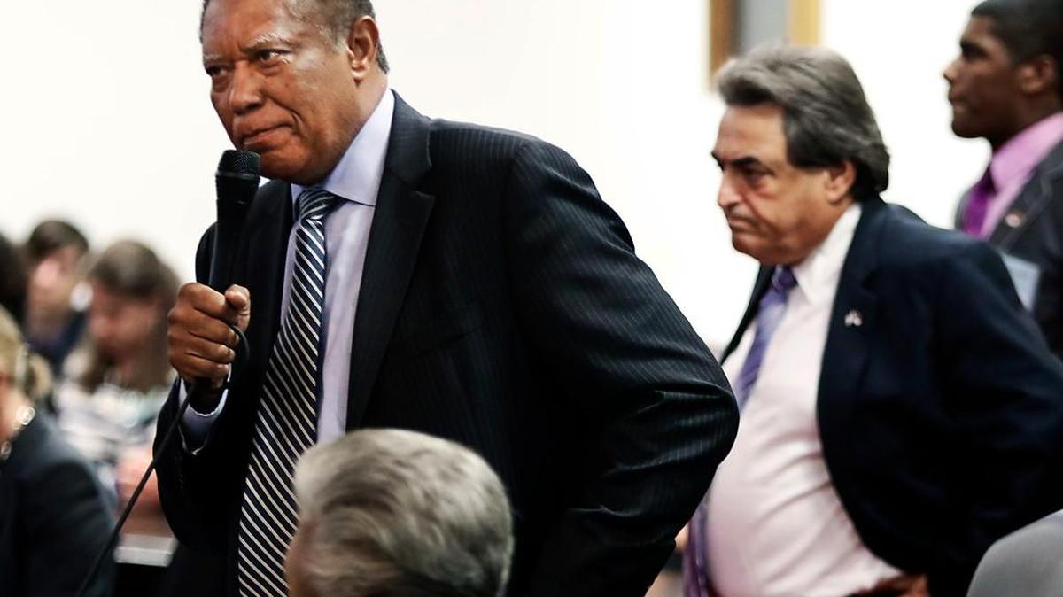 
NC State Senator Dan Blue (D-Wake County), left, stands to plead for more time for senators to read the budget compromise bill before them in the NC Senate Tuesday as fellow State Senator Bob Rucho (R-Mecklenburg County) listens before coming back to his seat in the NC Senate. The NC Senate debated a motion to back the House/Senate budget compromise which was just released to the public the day before. The Senate voted 33 in favor of and 16 opposed to approve the motion setting up a final vote for the budget compromise on Wednesday.
