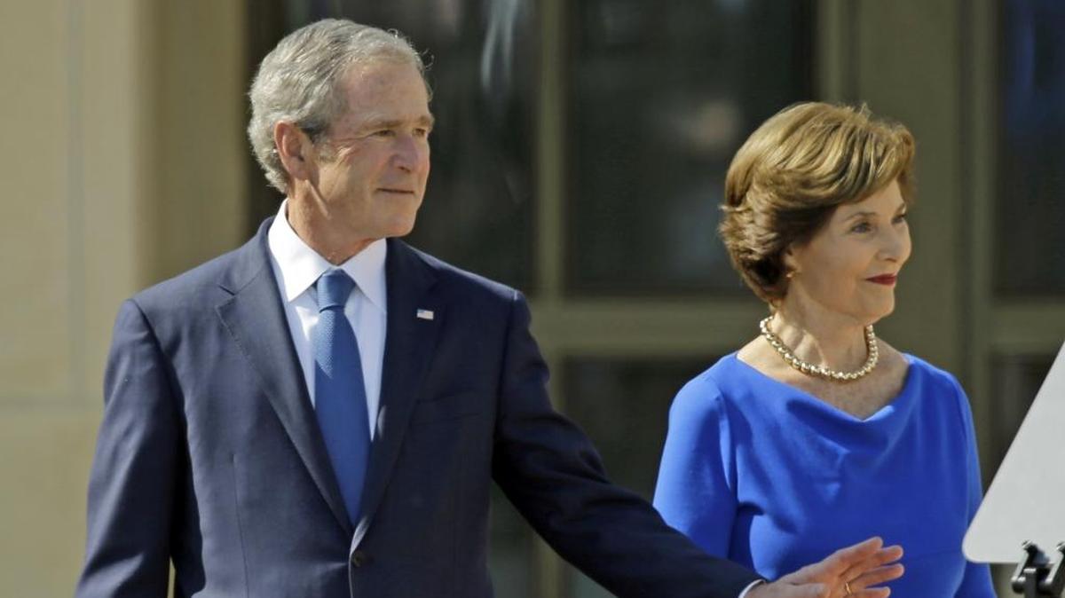 Former president George W. Bush and his wife, Laura, are shown in a 2013 file photo.