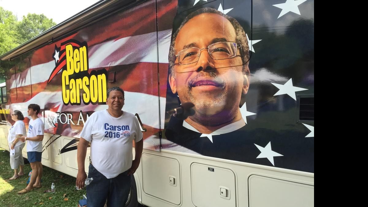 
Vernon Robinson in front of the Ben Carson RV
