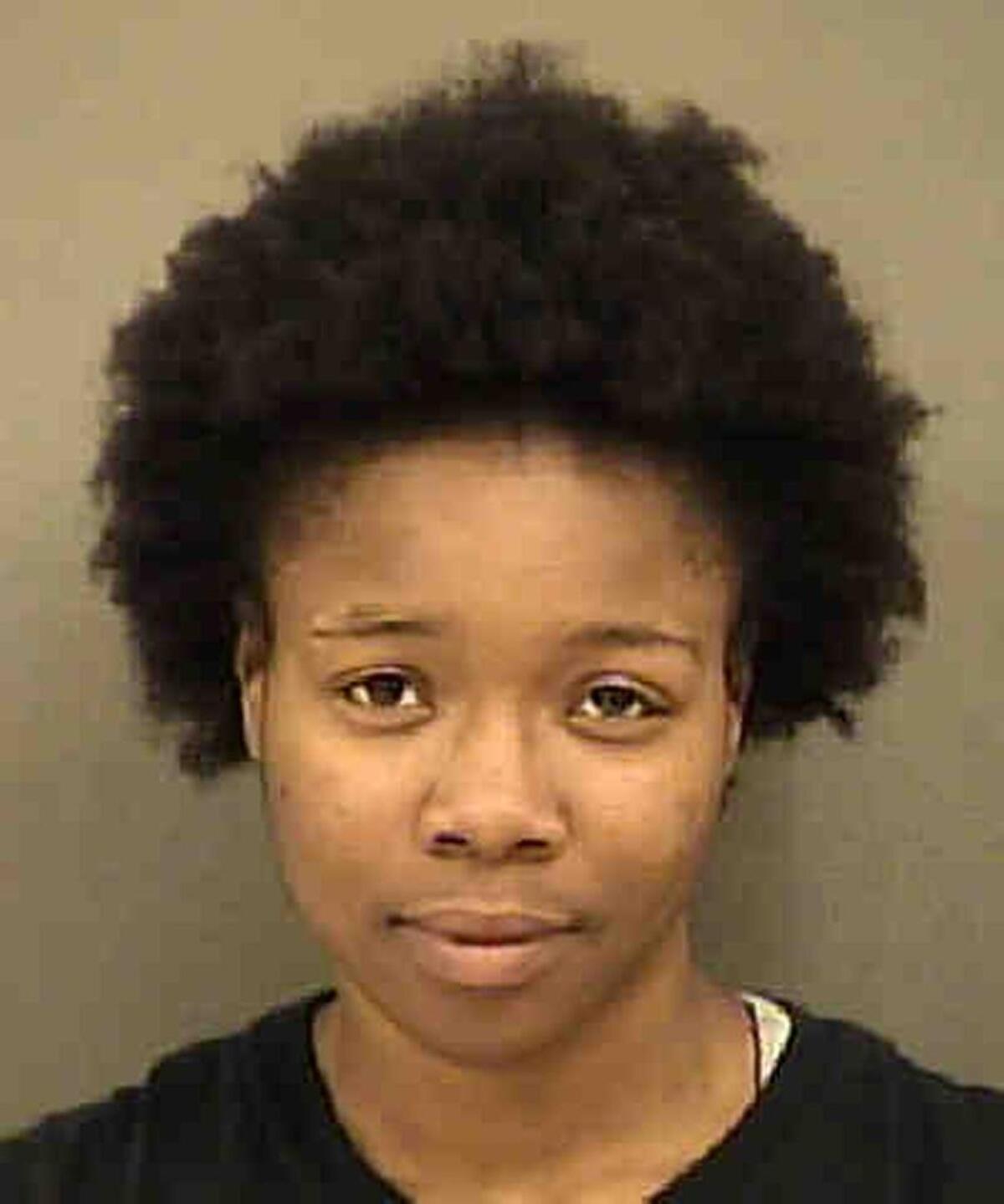 Gloria “Glo” Merriweather, 25, is accused of felony inciting to riot and a misdemeanor assault on a public official.