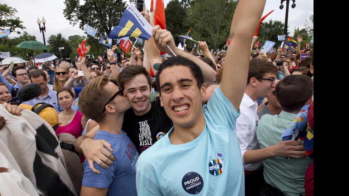 
Supporters of same-sex marriage celebrate outside of the Supreme Court in Washington, Friday June 26, 2015, after the court declared that same-sex couples have a right to marry anywhere in the US. (AP Photo/Jacquelyn Martin) 
