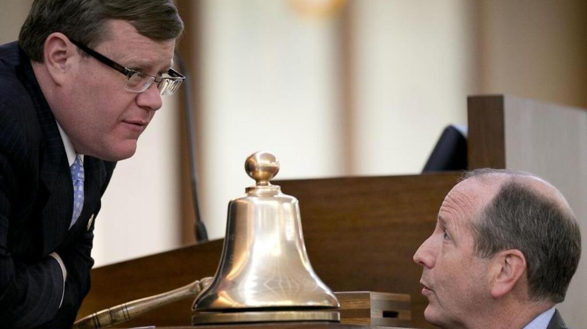 House Speaker Tim Moore talks with House Bill 2 sponsor Rep. Dan Bishop of Mecklenburg County, right during debate on the House floor on Wednesday, March 23, 2016 in Raleigh, N.C.