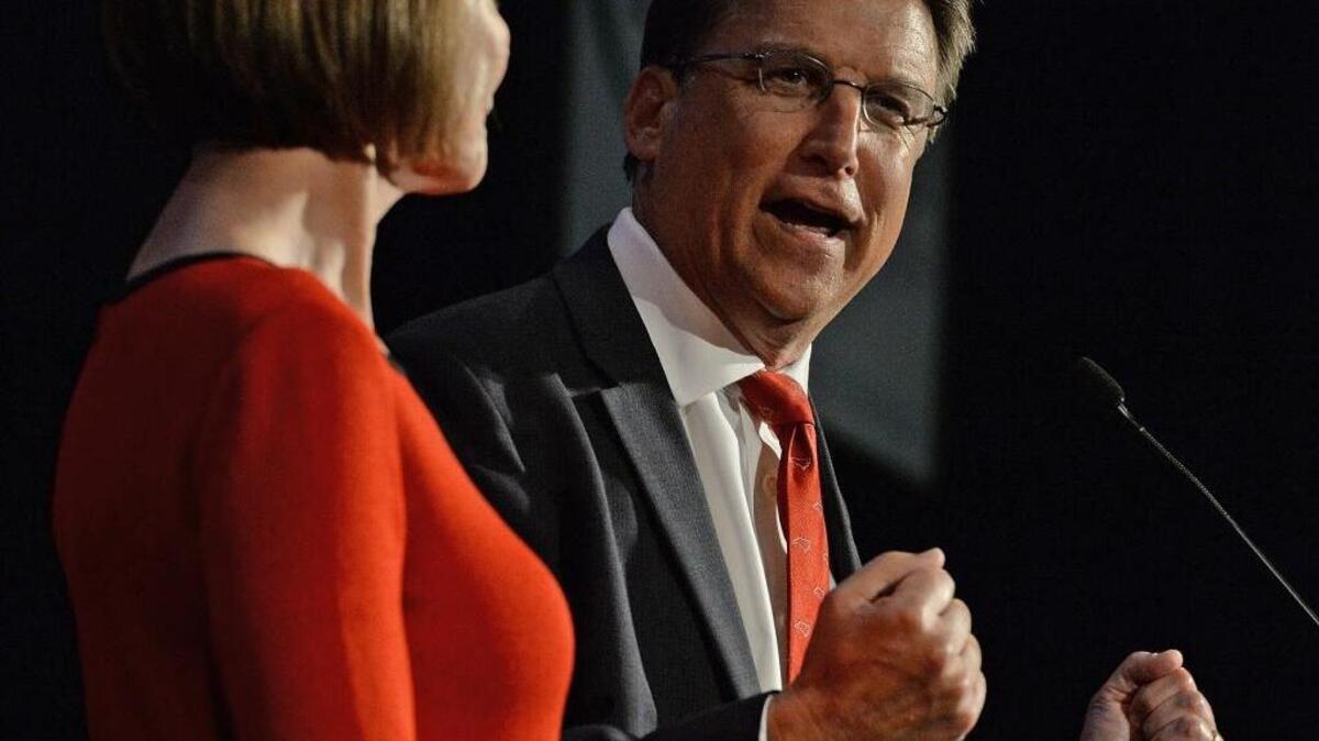 North Carolina Gov. Pat McCrory speaks to supporters with his wife Ann at his side at the Crabtree Marriott in Raleigh on Tuesday, Nov. 8. They were attending the Republican Party election results event.