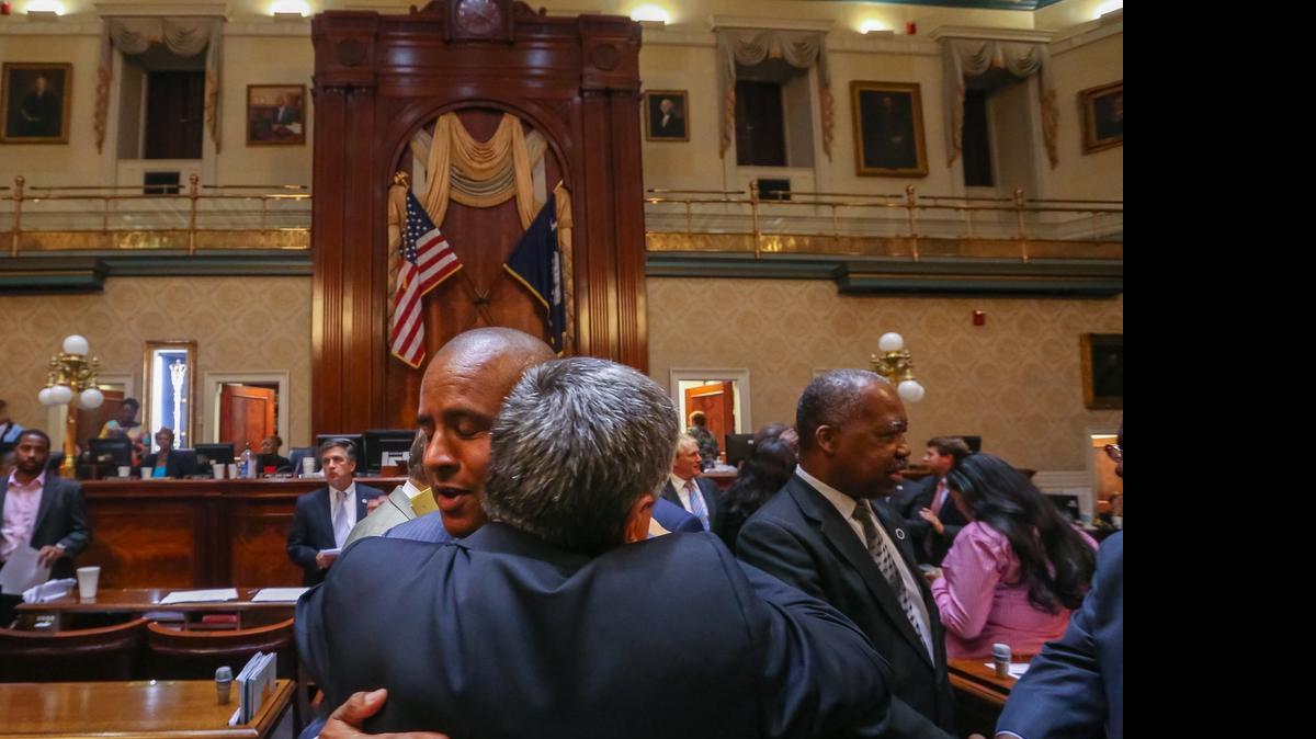 
Rep. Todd Rutherford and Rep. Leon Stavrinakis celebrate the passage of the bill that will remove the Confederate flag from the State House Grounds. 7/9/15
