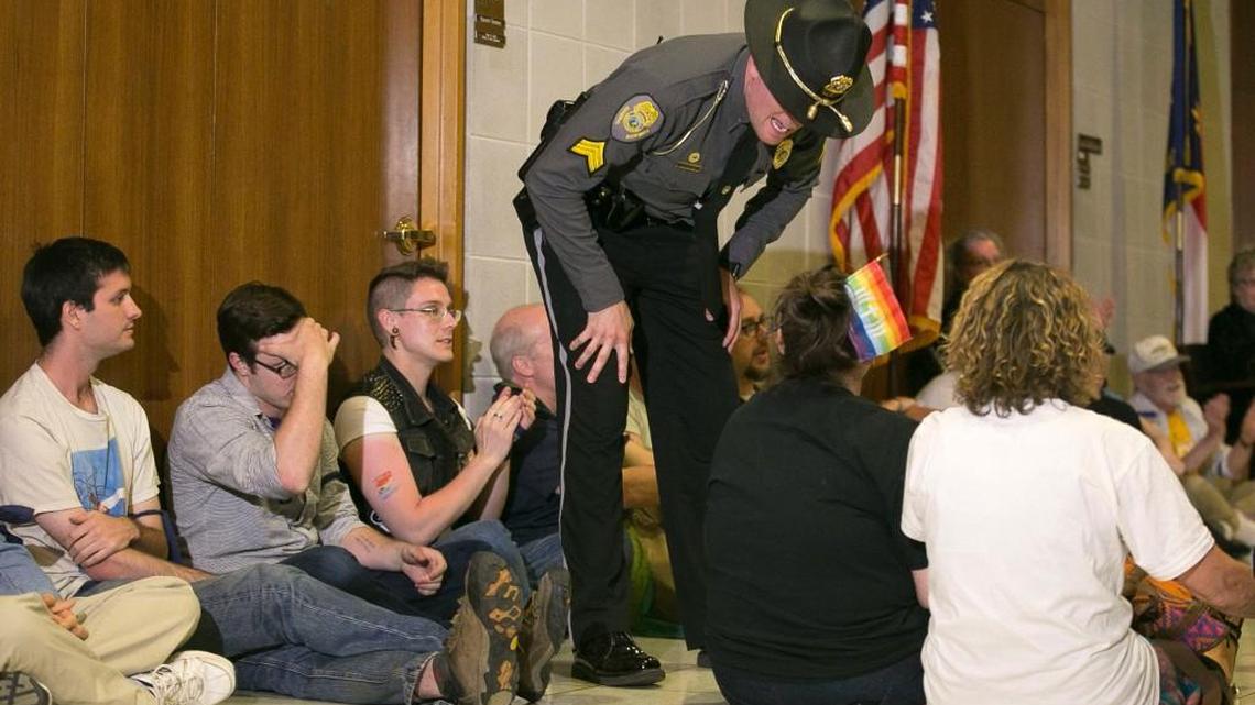 General Assembly police get ready to arrest the last of the 54 activists that staged a sit-in in front of House Speaker Tim Moore’s office in opposition to House Bill 2 at the State Legislative Building in Raleigh, N.C. on Monday April 25, 2016.