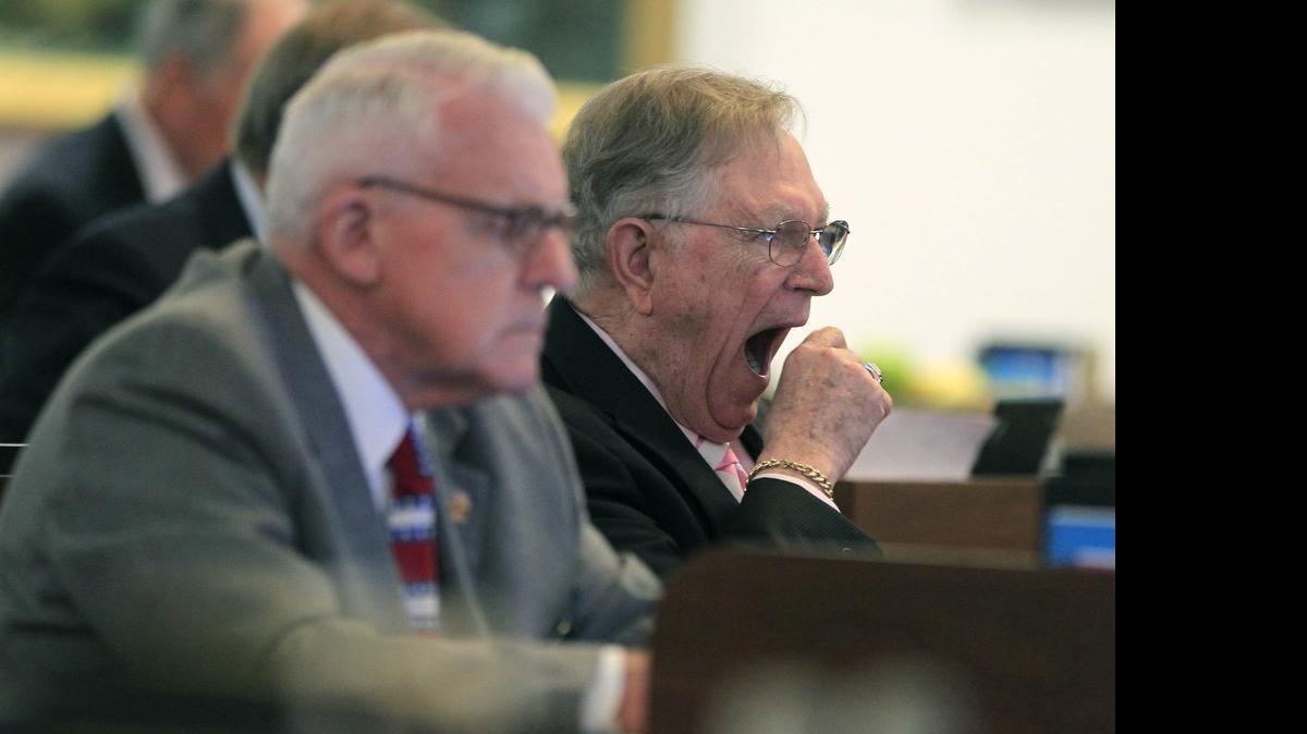 
Rep. James Langdon, Jr., let out a yawn while sitting next to Rep. George Cleveland during a 12-hour N.C. House session Wednesday. Cleveland said he took a nap after the session ended around 2:30 a.m. Thursday.
