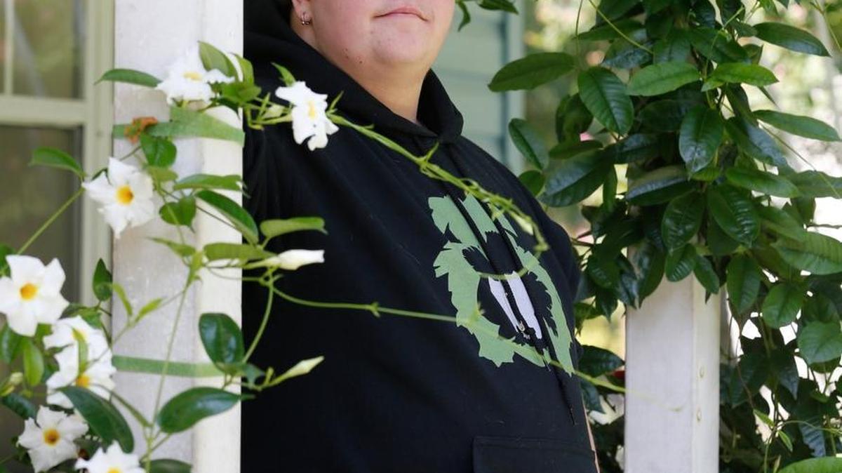 In this Aug. 25, 2015, file photo, Gavin Grimm poses on his front porch during an interview at his home in Gloucester, Va. The fate of North Carolina's new bathroom law could be determined by the 4th U.S. Circuit Court of Appeals in Richmond, which is expected to rule soon on Grimm's challenge. The high school student was born female but identifies as male, and says it's discriminatory to make him use the girls room or a single-stall unisex restroom.