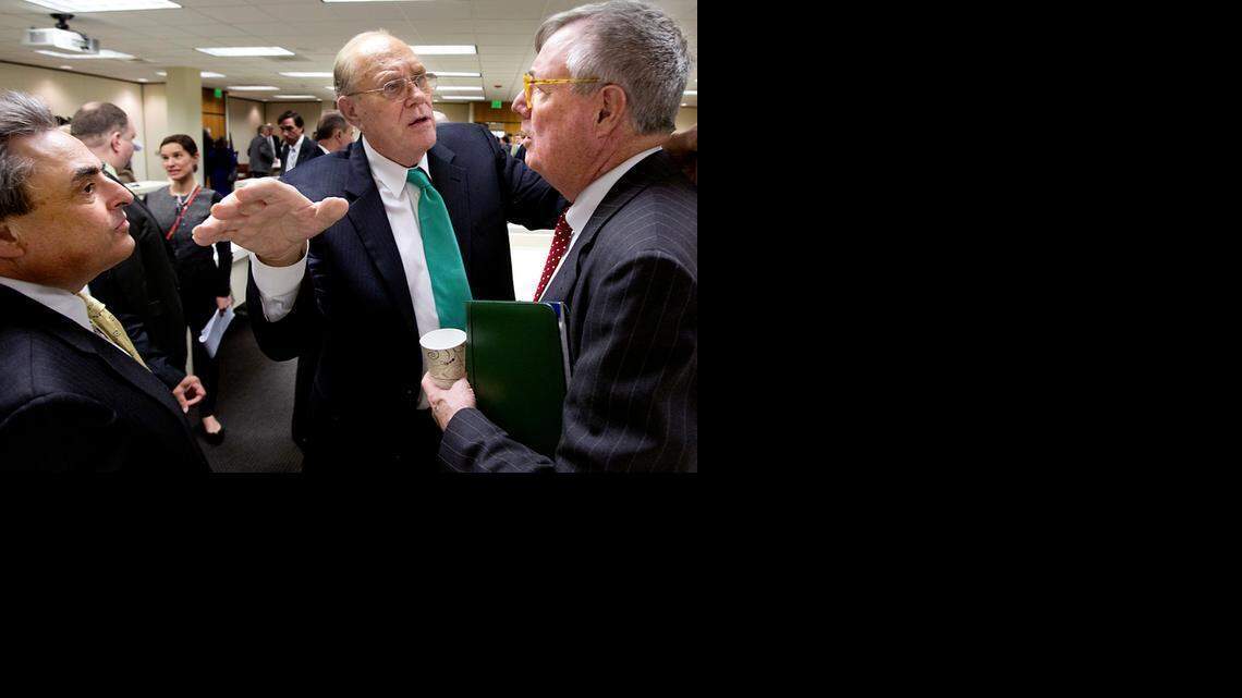 
Sen. Bob Rucho, left, and Sen. Jerry Tillman, center, both co-chairs, talk to John E. Skvarla, III, the Secretary of the North Carolina Department of Commerce, right, about the former JDIG (Job Development Investment Grant) program following a Senate Committee on Finance meeting at the N.C. General Assembly on Tuesday, March 17, 2015. The program has changed its name to the Job Growth Reimbursement Opportunities (JobGRO).
