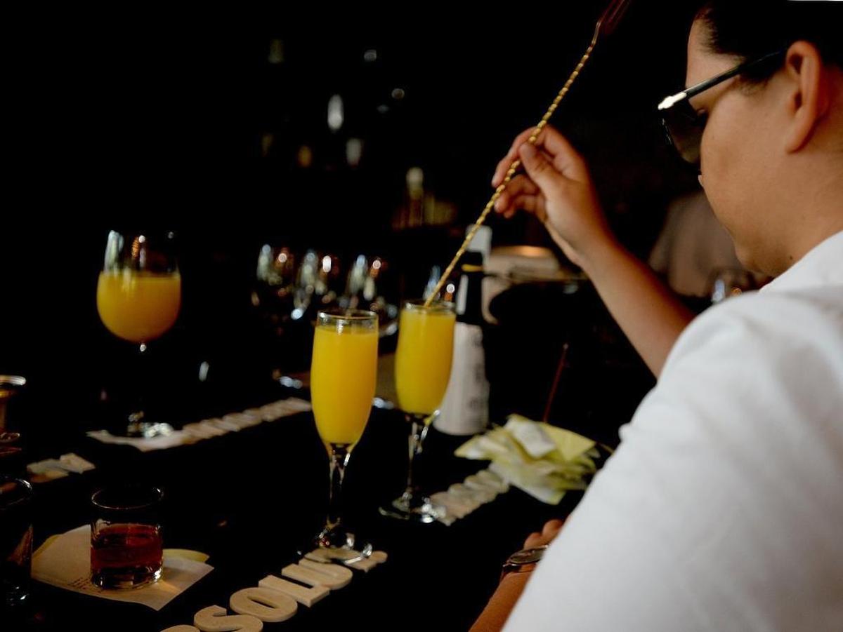 Mimosas are made at the bar as customers enjoy brunch at 5Church restaurant uptown on Sunday. Patrick Whalen, the operating manager at 5Church in uptown Charlotte, said the biggest difference would be for the customer, who is getting more options.