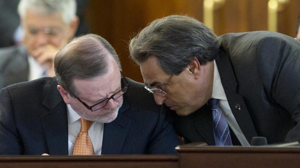 Senate Pro Tem Phil Berger, left, confers with Sen. Bob Rucho as the proposed budget bill is debated during the Senate session at the Legislature in 2014.