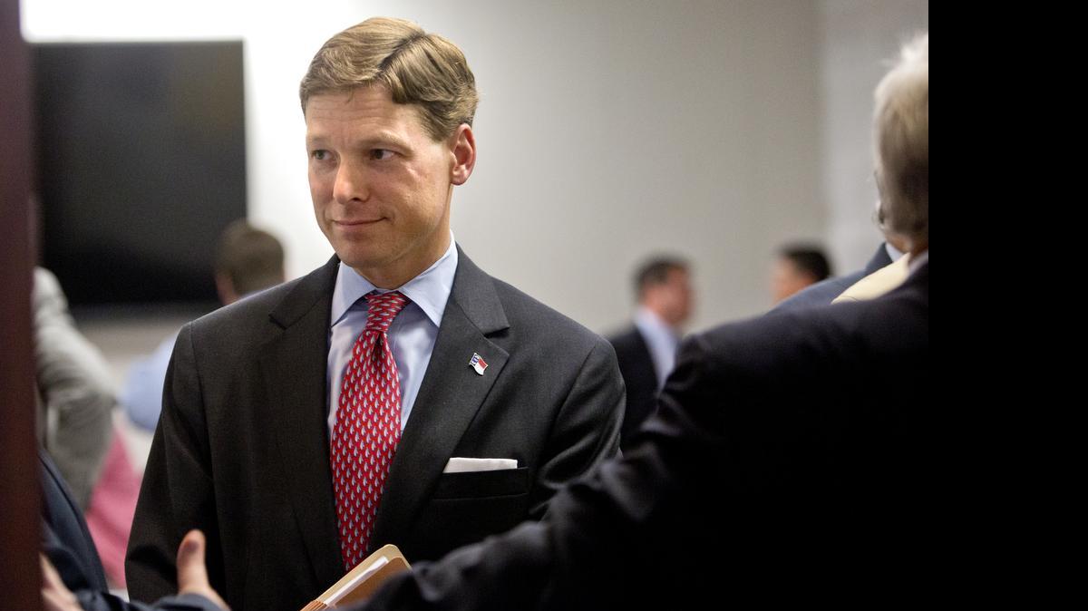 
N.C. State Budget Director Lee Roberts, center, talks with members of the Senate Republican Caucuses after a closed-door meeting. Governor Pat McCrory, not seen, discussed the state budget and the bond proposal to both the Republican House and Senate Caucuses at the N.C. General Assembly in Raleigh on Thursday, July 16, 2015.
