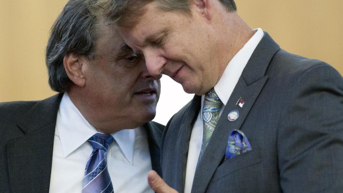 House Majority Leader Mike Hager, right, says his opponents are trying to recruit a Republican opponent to challenge him in the March primary.