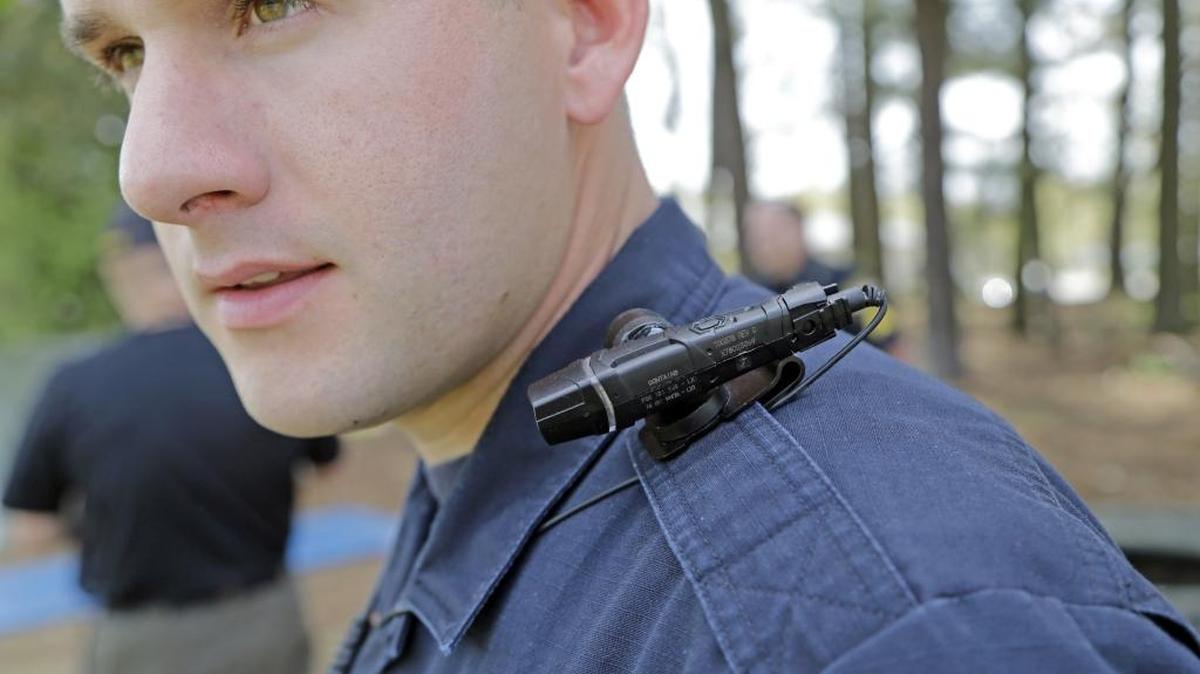 Garner police officer Kevin Murray tests a body camera as he wears one before starting his patrol in Garner on April 8, 2015.