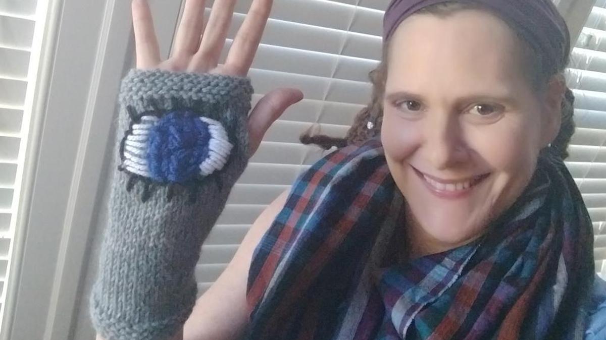 JoDee Collins of Charlotte models an evil eye glove she made for people going to the March For Our Lives.