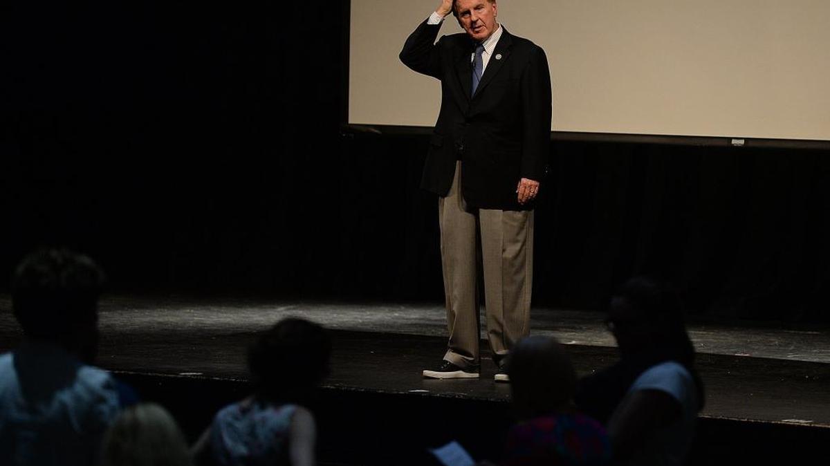 U.S. Rep Robert Pittenger listens to questions from a large crowd during his town hall meeting Thursday night at Providence High School. The meeting reflected the deepening divisions across the county as well as liberal rancor toward Trump and a Republican congressman who has been one of his outspoken supporters.