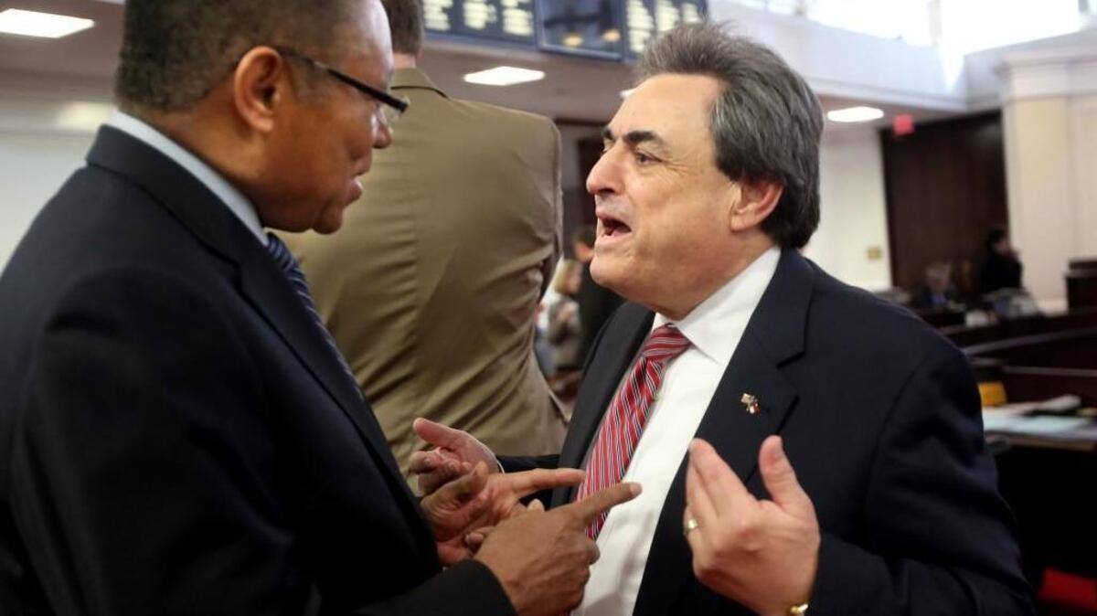 Democratic Sen. Dan Blue, left, and Republican Sen. Bob Rucho talk before a morning session of the N.C. Senate on Thursday, Feb. 18, 2016. The legislature convened to redraw the state’s congressional map.