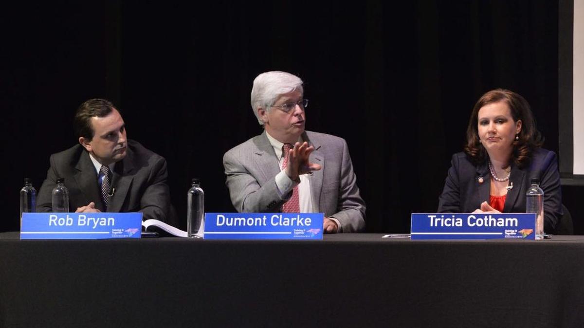 Mecklenburg Commissioner Dumont Clarke, center, says he won’t run for re-election after nine terms.